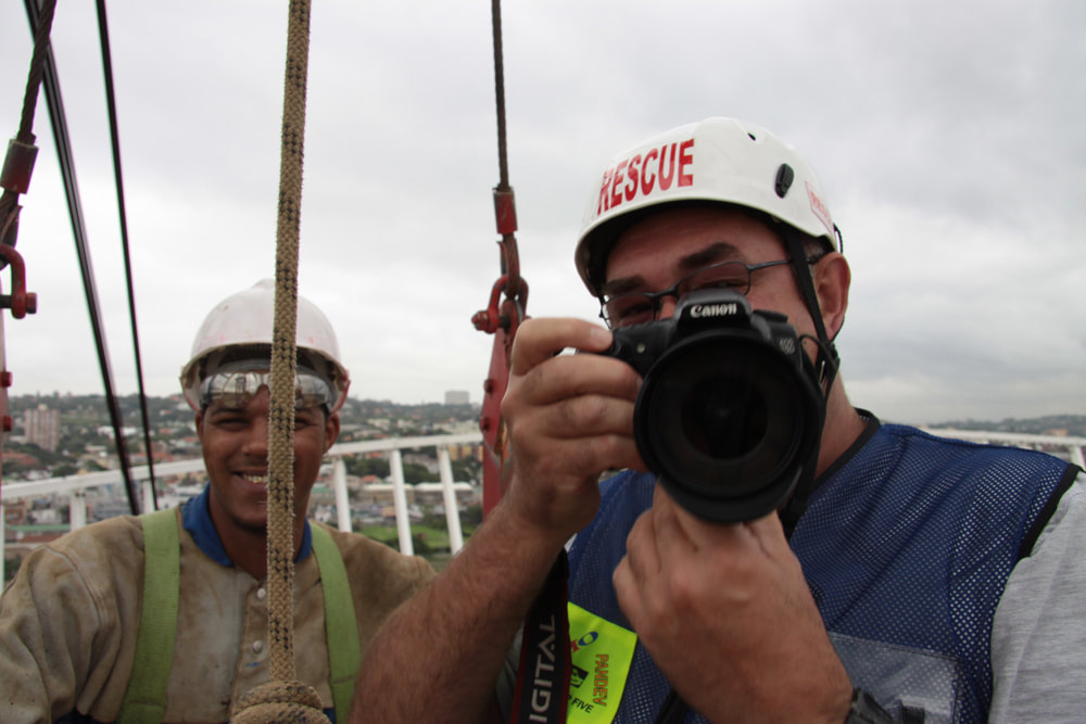 Me in  the basket on the crane at work on the Moses Mabhida Stadium.